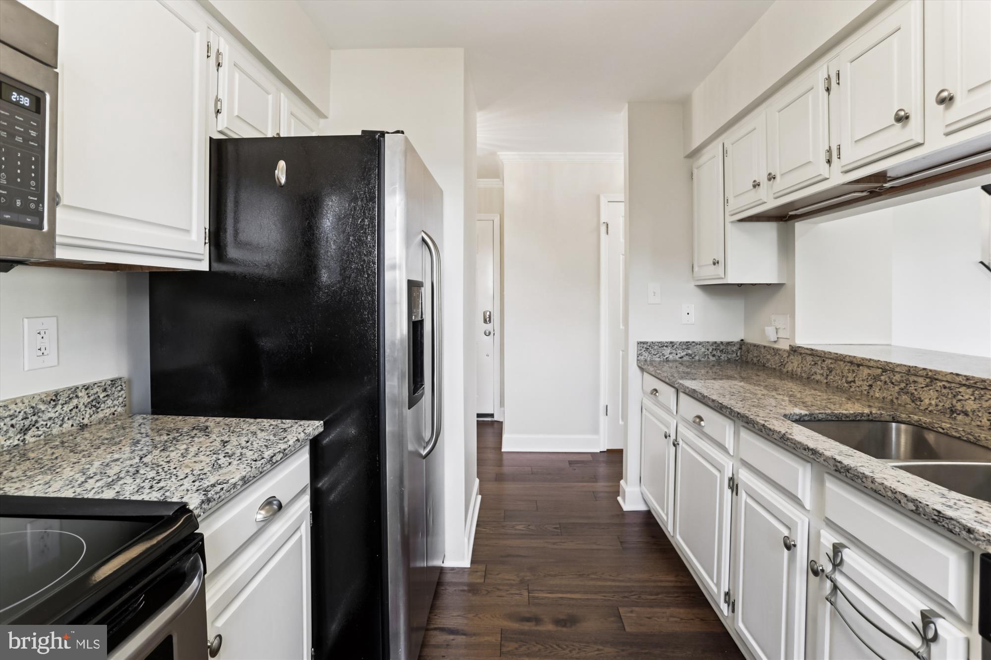 945 South Scott Street Arlington, VA 22204 - Photo 10 of 39 a kitchen with stainless steel appliances granite countertop a refrigerator and a stove