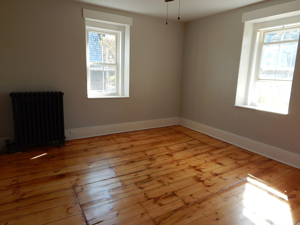 128 Allen Street Athol, MA 01331 - Photo 20 of 27 a view of empty room with wooden floor and fan