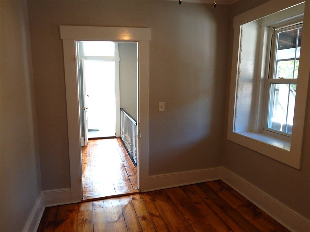 128 Allen Street Athol, MA 01331 - Photo 26 of 27 an empty room with wooden floor and windows
