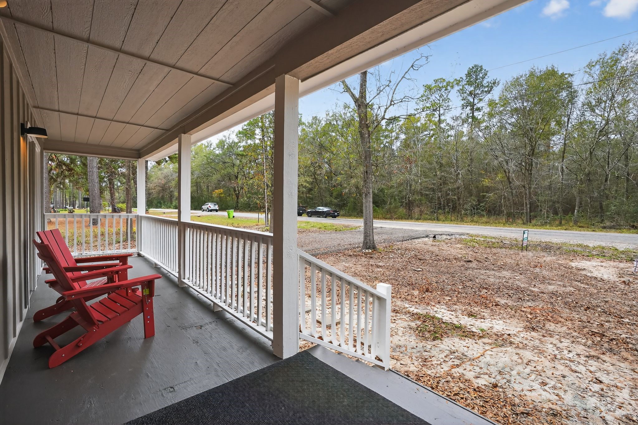 27 Deerfield Road Huntsville, TX 77340 - Photo 11 of 46 a view of a porch with wooden floor and outdoor space