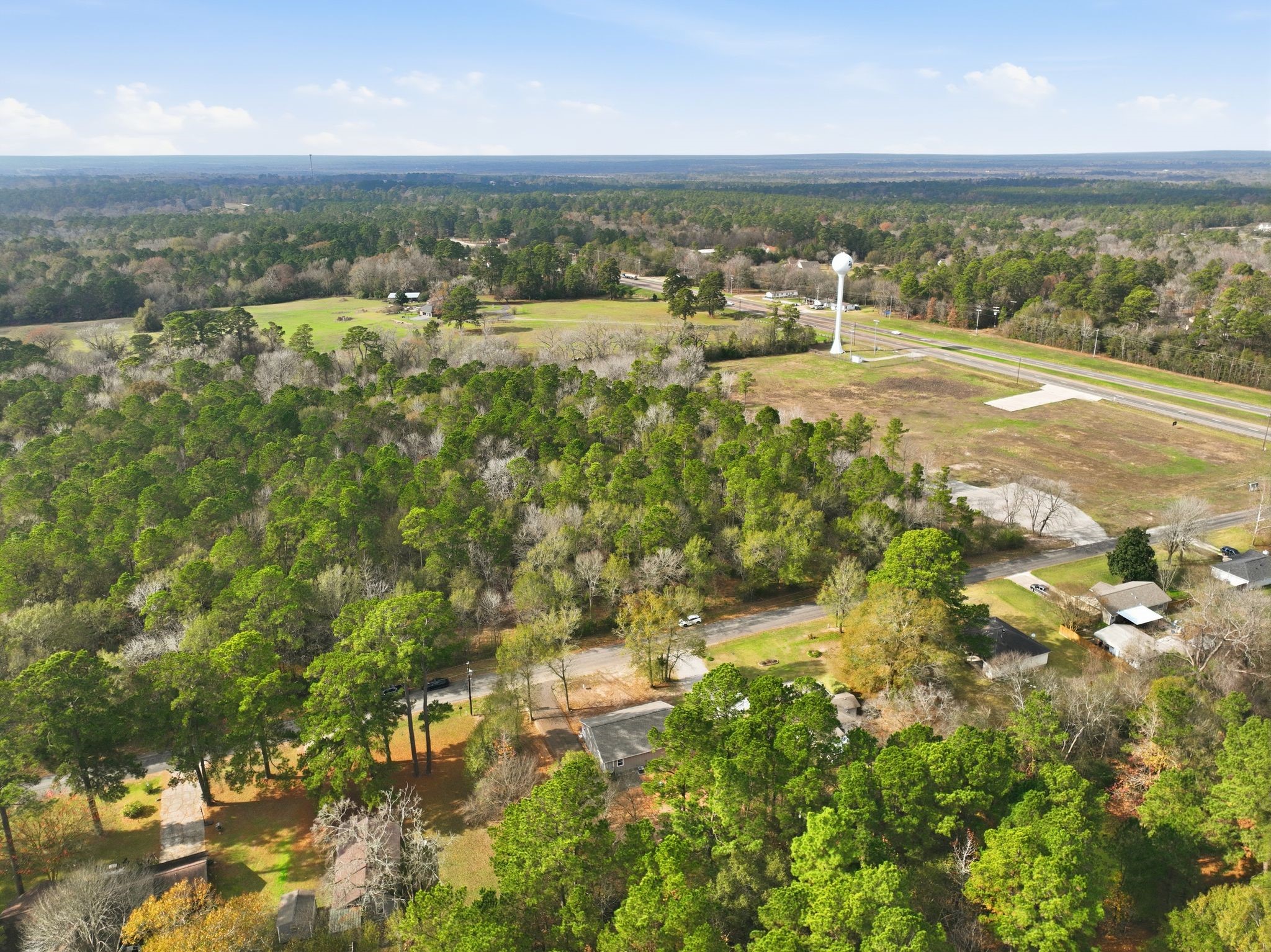 27 Deerfield Road Huntsville, TX 77340 - Photo 26 of 46 a view of an outdoor space and a lake view
