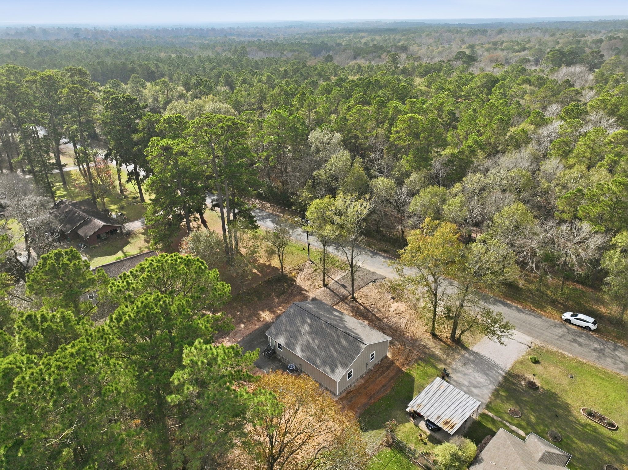27 Deerfield Road Huntsville, TX 77340 - Photo 28 of 46 an aerial view of residential houses with outdoor space