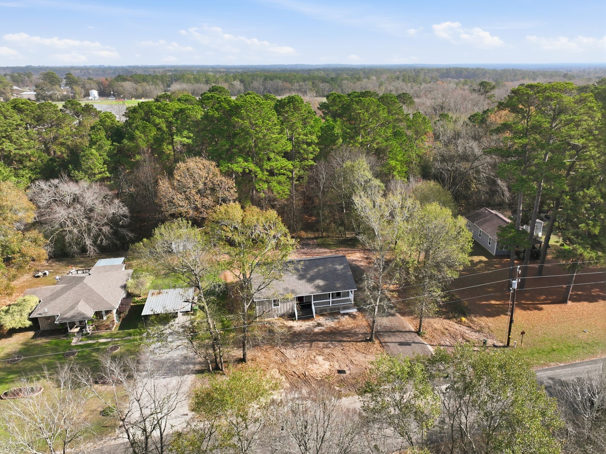 27 Deerfield Road Huntsville, TX 77340 - Photo 30 of 46 an aerial view of residential house with green space