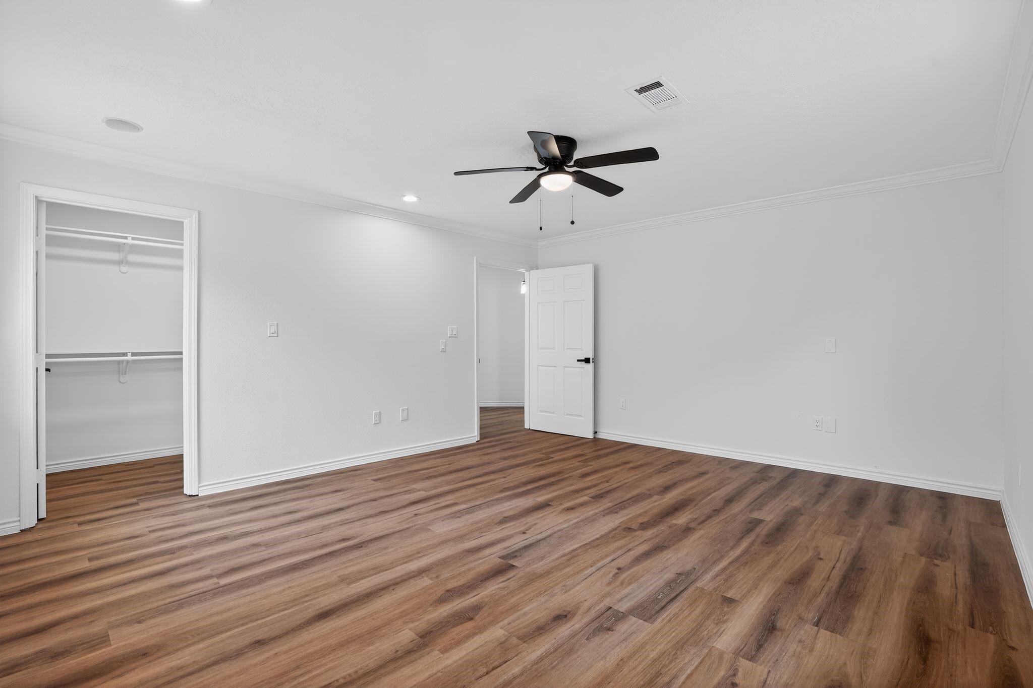 27 Deerfield Road Huntsville, TX 77340 - Photo 41 of 46 a view of empty room with wooden floor and fan