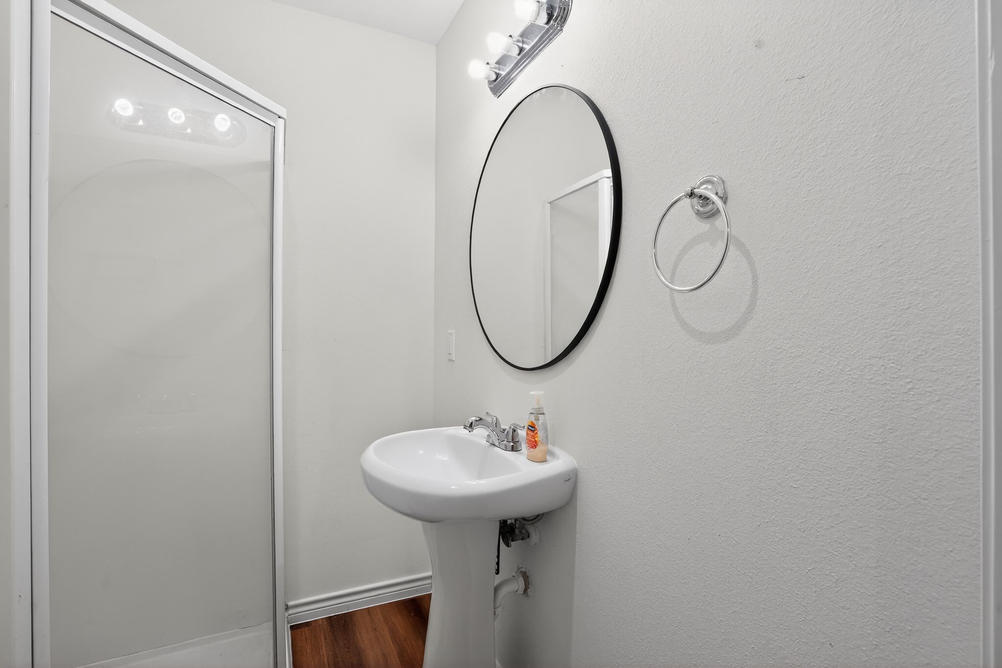 27 Deerfield Road Huntsville, TX 77340 - Photo 42 of 46 a bathroom with a sink and a mirror