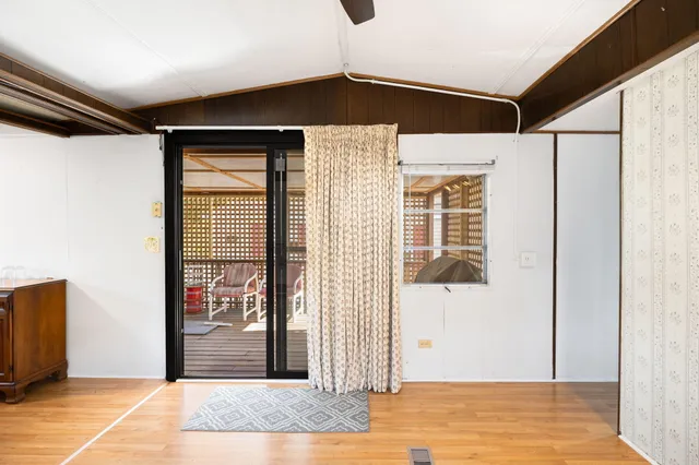 a view of a door and an empty room