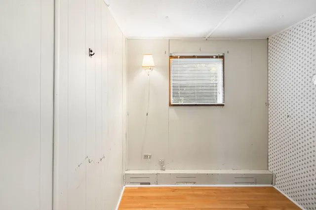 a view of room with window and hardwood floor