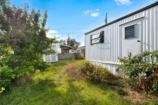 a house view with a backyard space