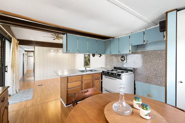 a kitchen with stainless steel appliances granite countertop a sink and cabinets