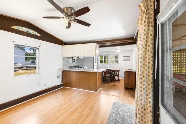 a view of kitchen with furniture and a window