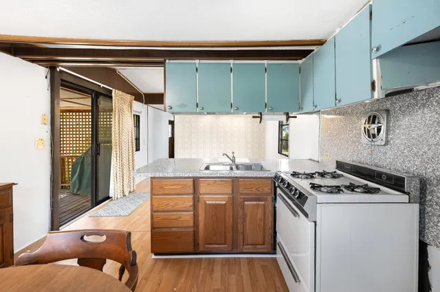 a kitchen with cabinets and appliances