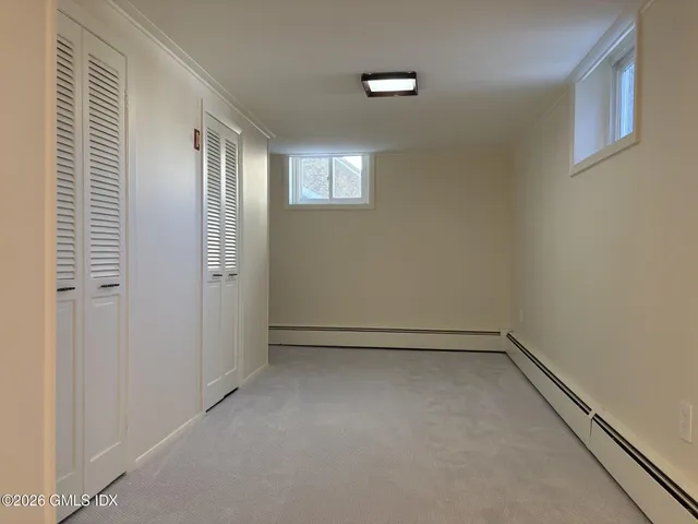 a view of an empty room with windows