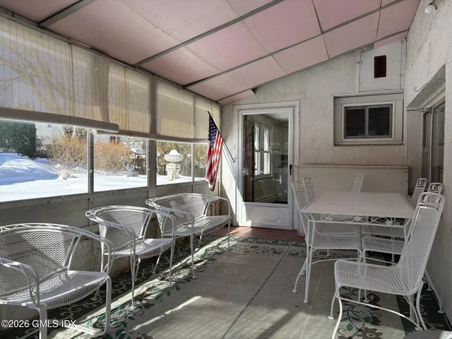 a outdoor space with lots of chairs and mirrors