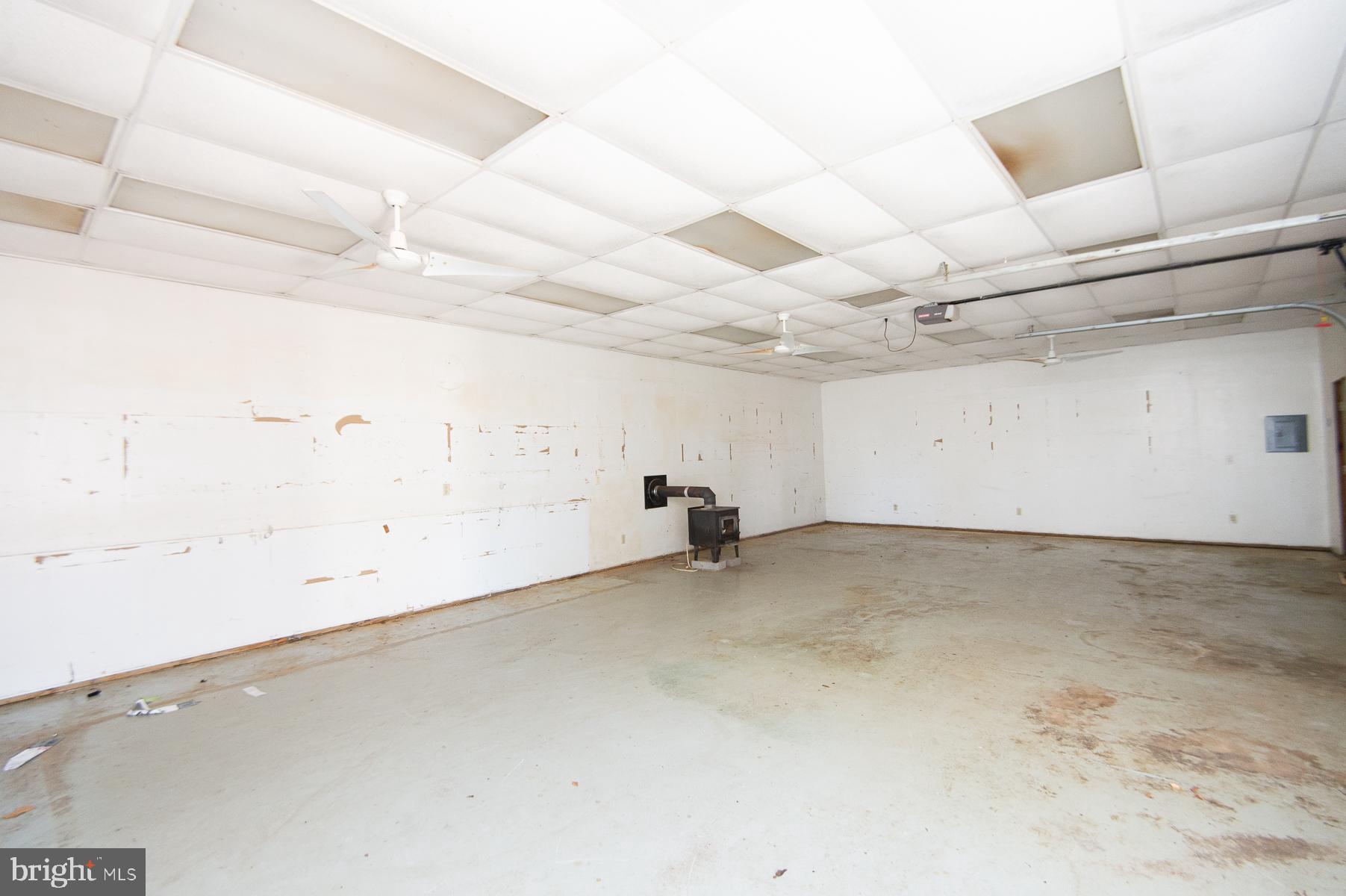 521 Academy Street Hurlock, MD 21643 - Photo 47 of 67 Inside pole barn w stove