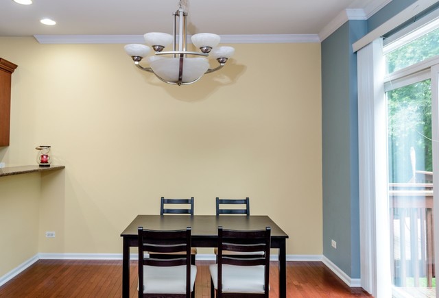 229 Ridge Road North Aurora, IL 60542 - Photo 6 of 18 a view of a dining room with furniture wooden floor and chandelier