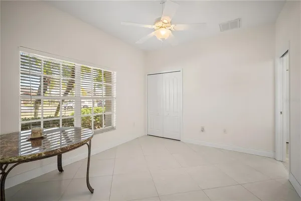 a view of room with a ceiling fan