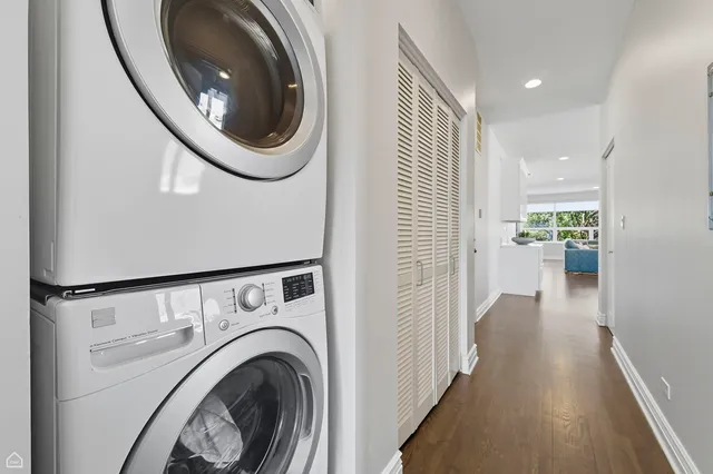 a view of a hallway with washer and dryer