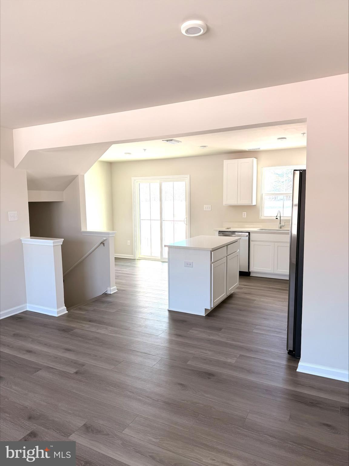 1180 West Walnut Road Vineland, NJ 08360 - Photo 3 of 19 a room with stainless steel appliances kitchen island wooden floors and view living room