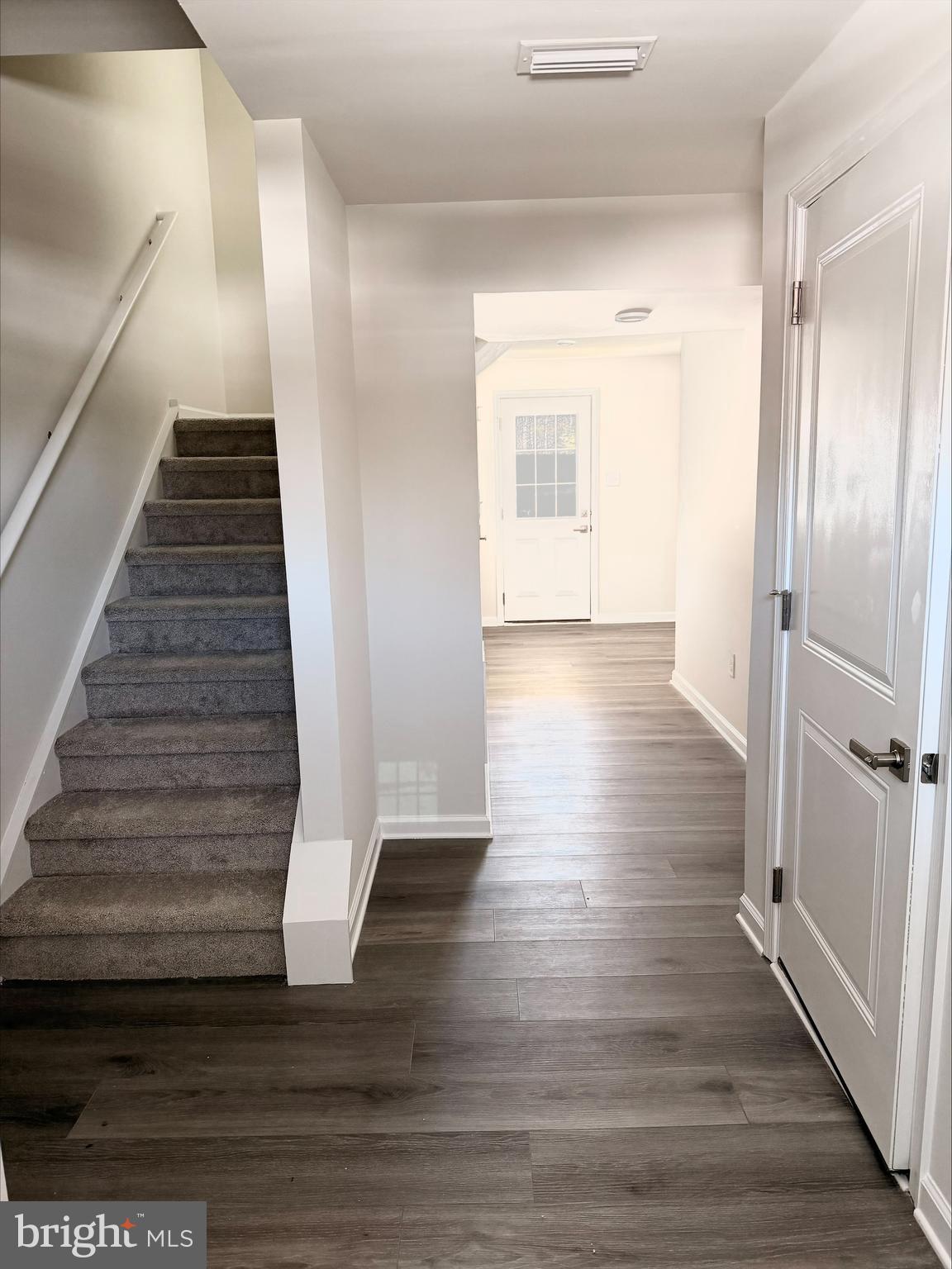 1180 West Walnut Road Vineland, NJ 08360 - Photo 9 of 19 a view of entryway and hall with wooden floor