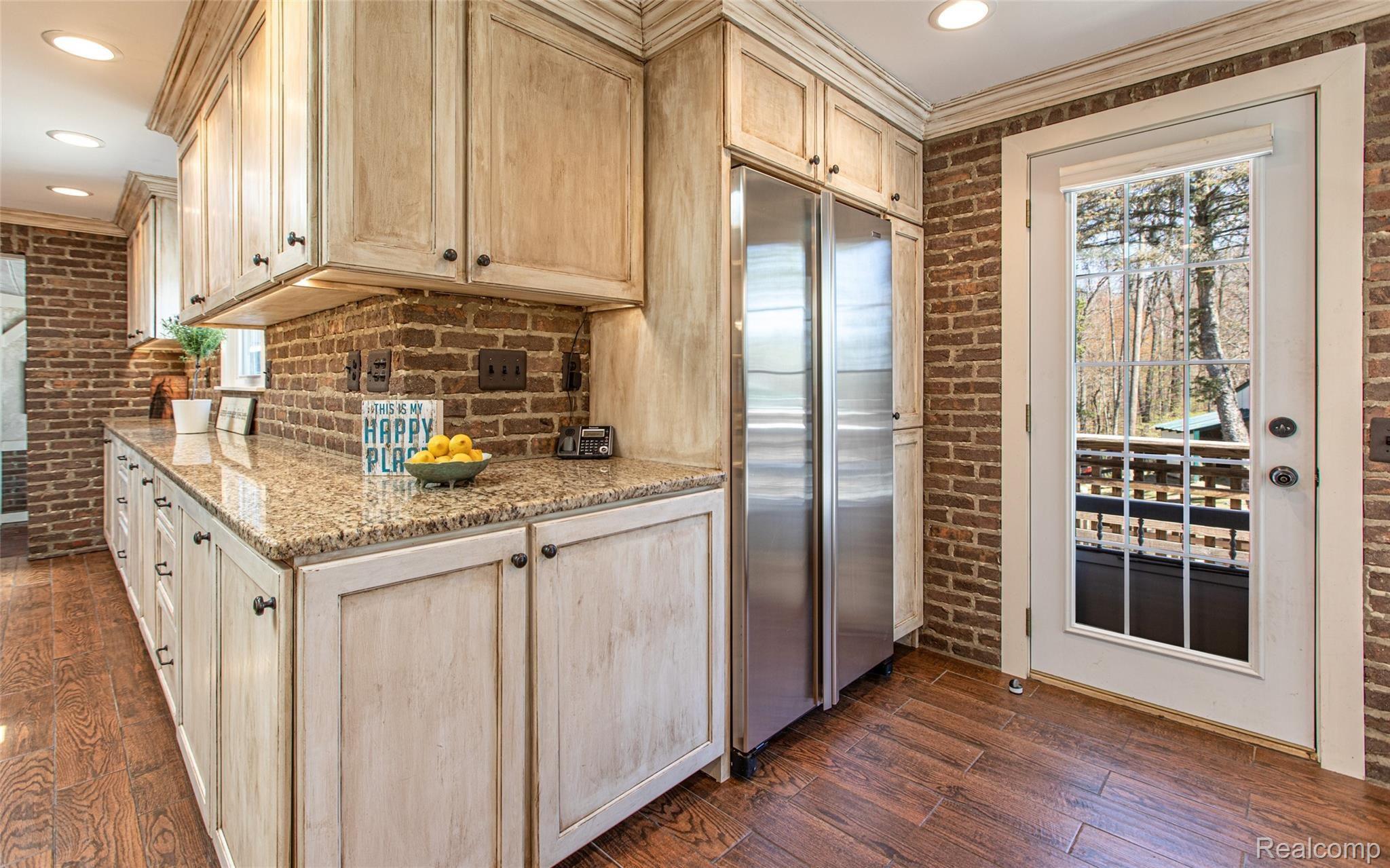 5820 Hempstead Road Metamora, MI 48455 - Photo 23 of 73 23 - Kitchen with access to Mini Front Patio & Side Deck that overlooks Mini Horse Pasture.jpg