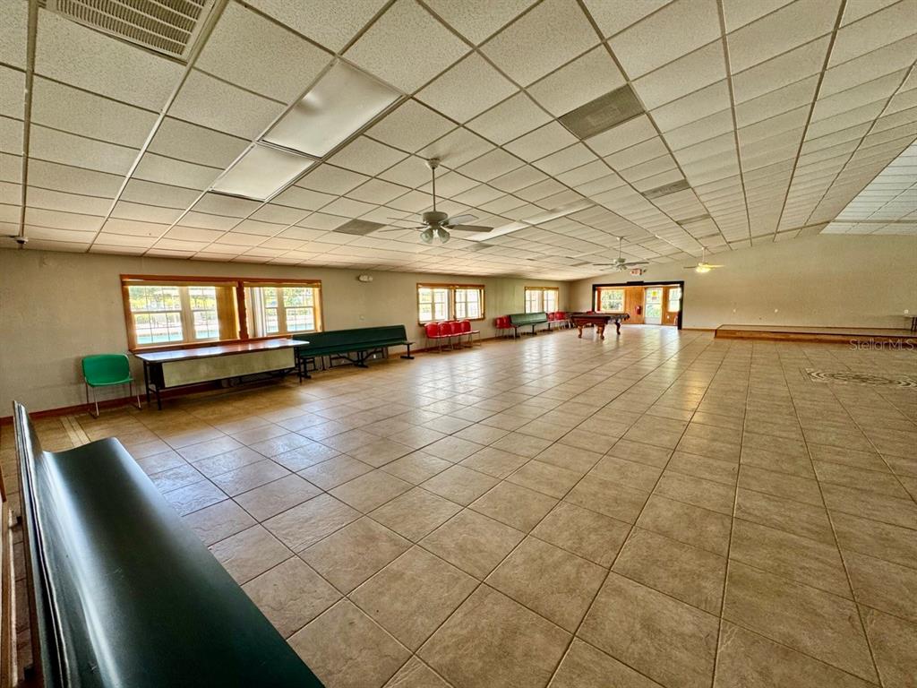 15991 Northeast 243rd Place Road, Unit 56 Fort McCoy, FL 32134 - Photo 13 of 16 a view of empty room with wooden floor