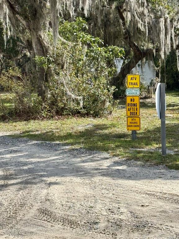 15991 Northeast 243rd Place Road, Unit 56 Fort McCoy, FL 32134 - Photo 16 of 16 a view of street with sign board