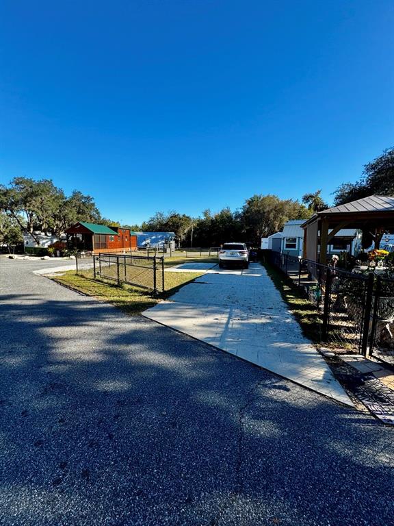 15991 Northeast 243rd Place Road, Unit 56 Fort McCoy, FL 32134 - Photo 3 of 16 a view of a street with an ocean view
