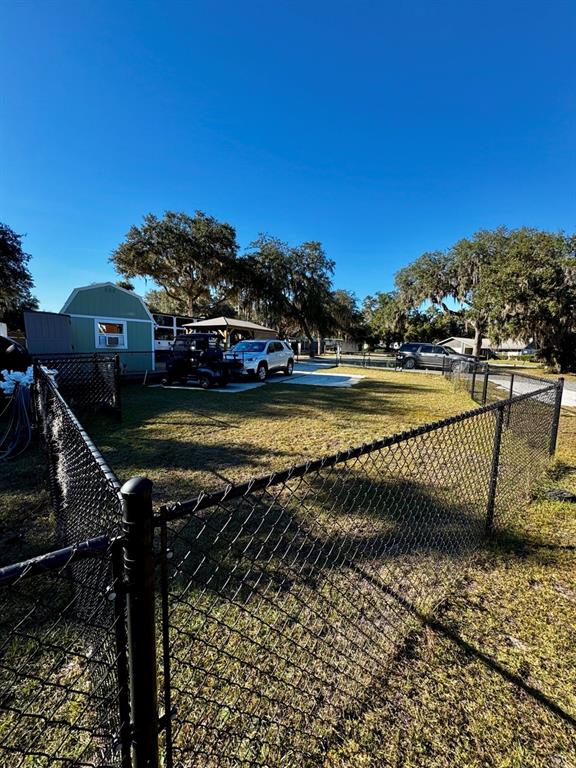 15991 Northeast 243rd Place Road, Unit 56 Fort McCoy, FL 32134 - Photo 4 of 16 a view of a swimming pool with a chair and a ocean view