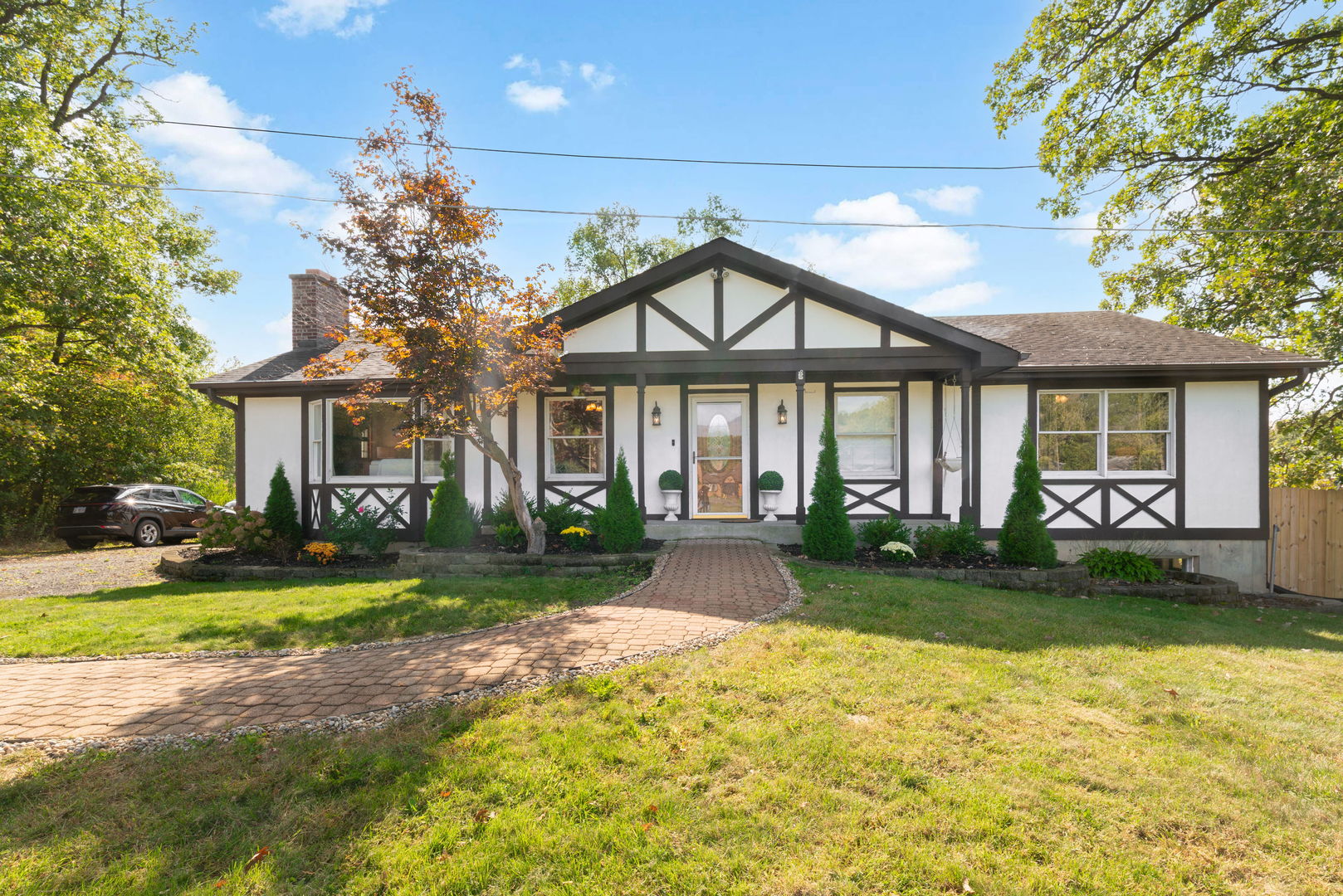 a front view of a house with garden
