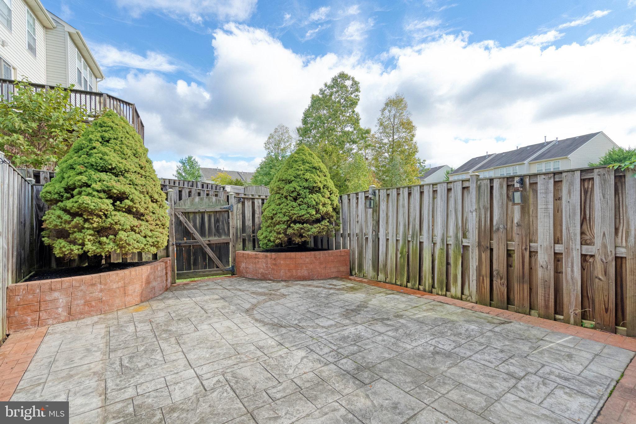 9854 Maitland Loop Bristow, VA 20136 - Photo 2 of 10 Rear patio stamped concrete