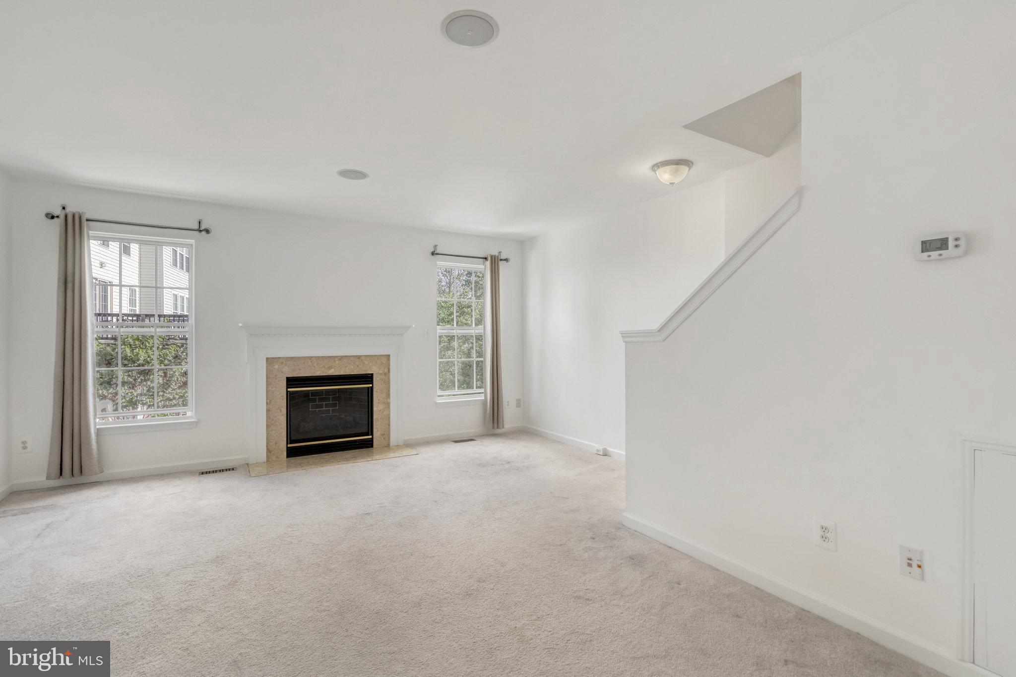 9854 Maitland Loop Bristow, VA 20136 - Photo 4 of 10 Second Level Family Room with Gas Fireplace