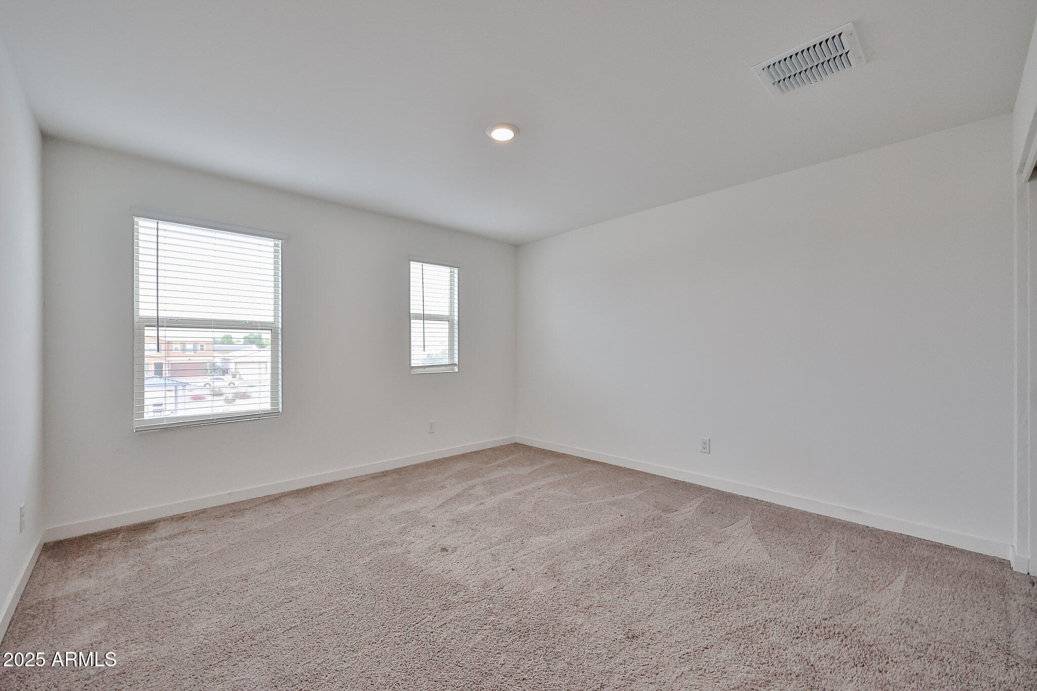509 East Elm Lane Avondale, AZ 85323 - Photo 17 of 40 an empty room with windows