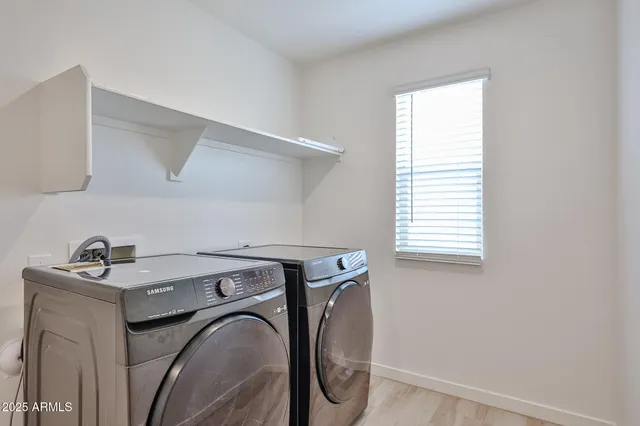 a utility room with dryer and washer