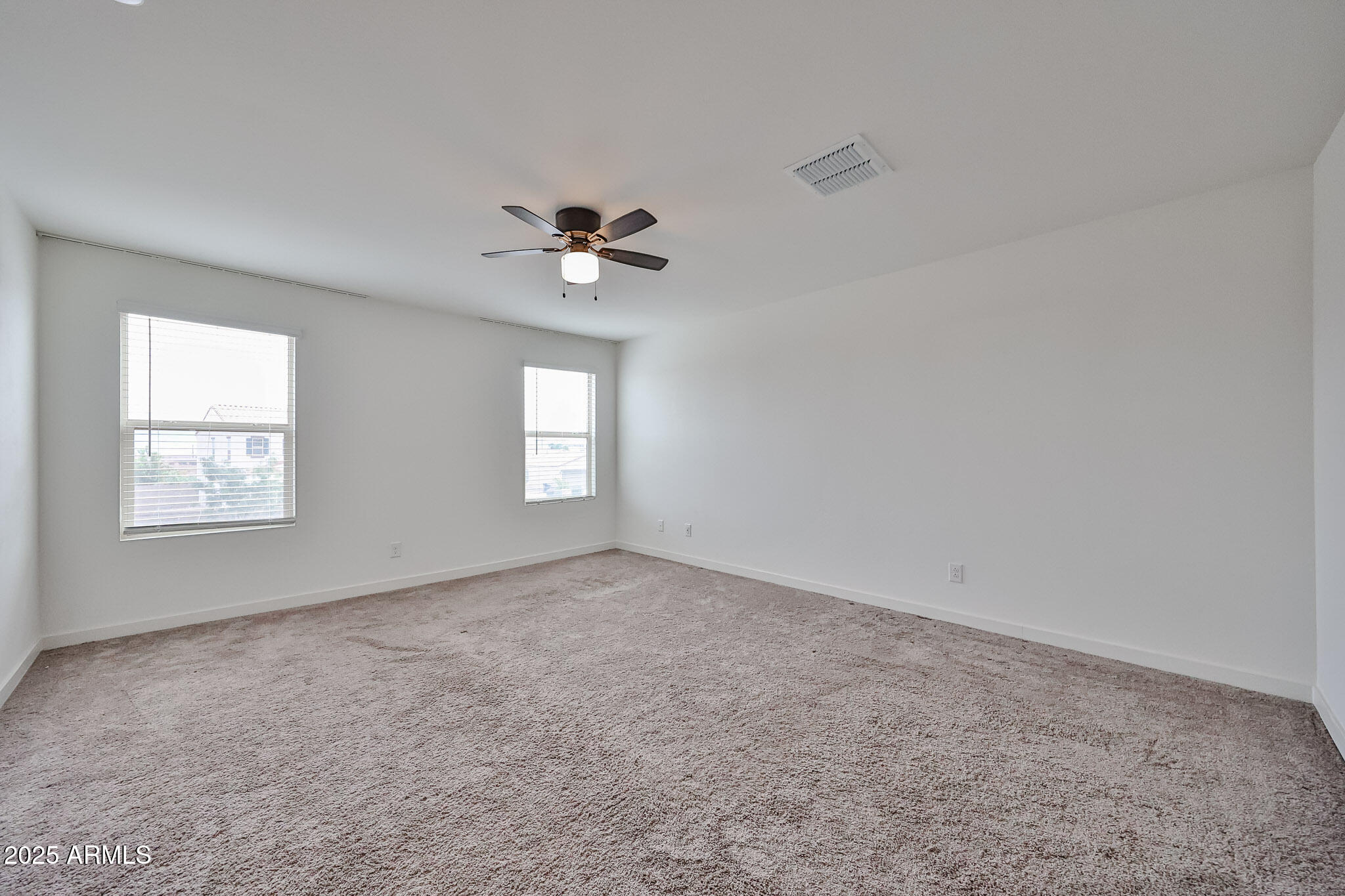 509 East Elm Lane Avondale, AZ 85323 - Photo 23 of 40 a view of an empty room with a window