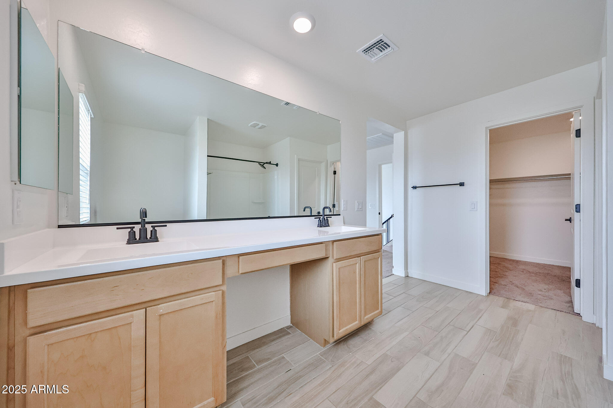 509 East Elm Lane Avondale, AZ 85323 - Photo 27 of 40 a bathroom with a sink and a mirror