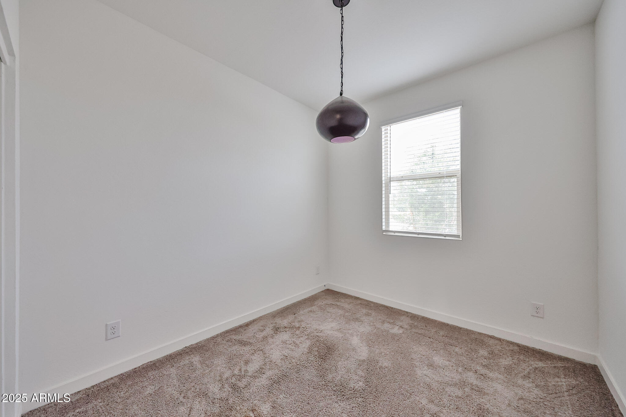 509 East Elm Lane Avondale, AZ 85323 - Photo 29 of 40 a view of an empty room with a window