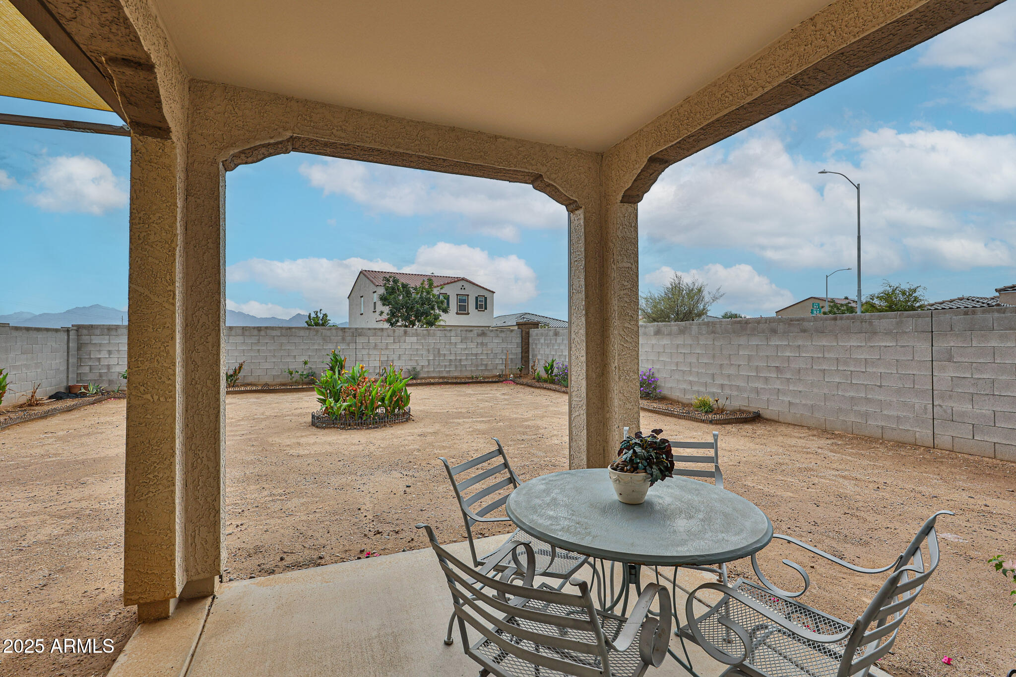 509 East Elm Lane Avondale, AZ 85323 - Photo 32 of 40 a dining room with furniture and a floor to ceiling window