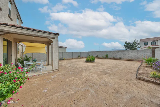 a view of a garden with an outdoor seating
