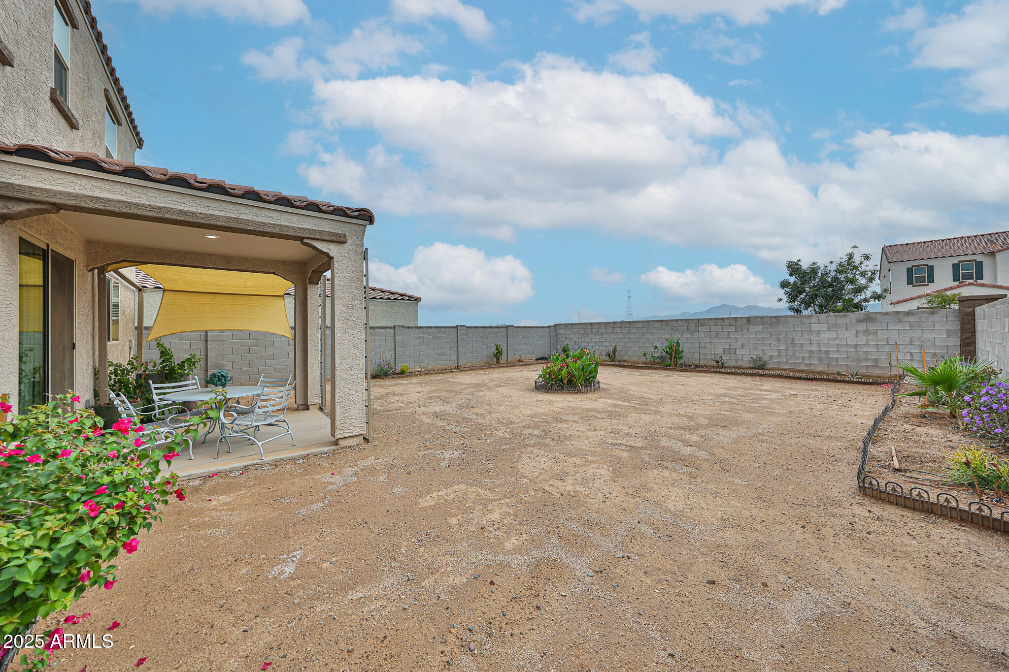 509 East Elm Lane Avondale, AZ 85323 - Photo 36 of 40 a view of a garden with an outdoor seating