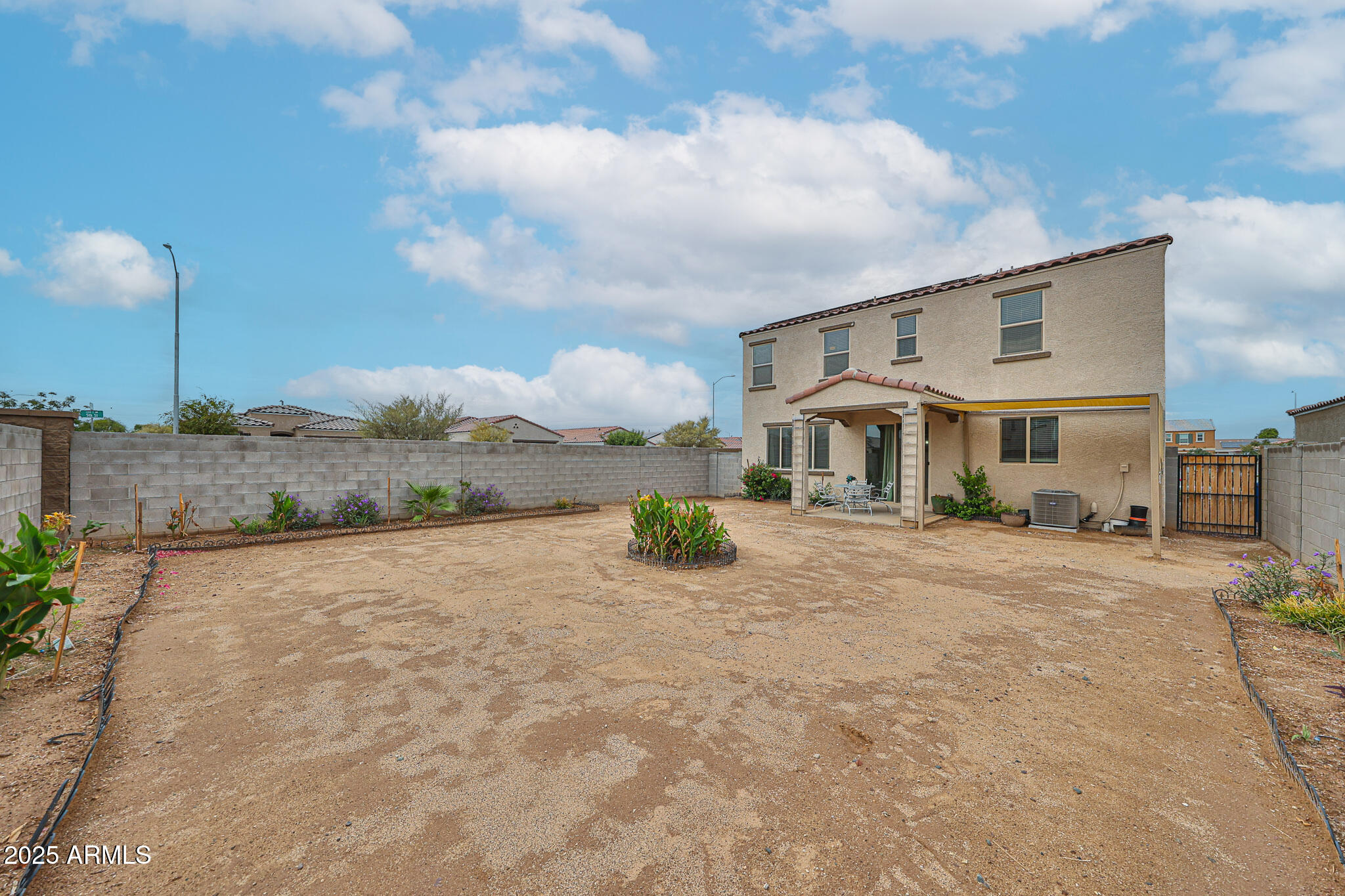 509 East Elm Lane Avondale, AZ 85323 - Photo 37 of 40 a front view of a house with a yard and garage