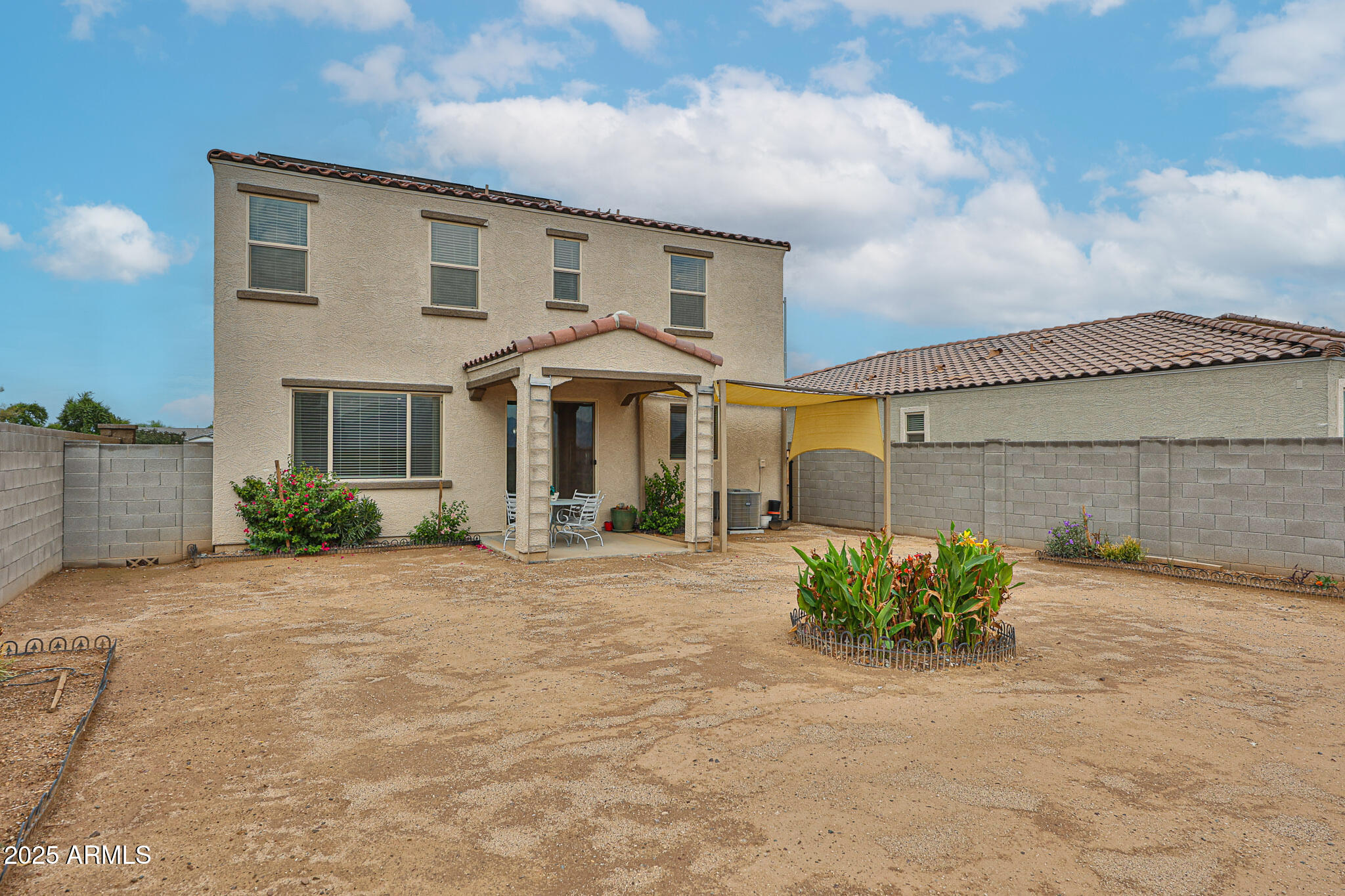 509 East Elm Lane Avondale, AZ 85323 - Photo 39 of 40 a front view of a house with a yard and garage