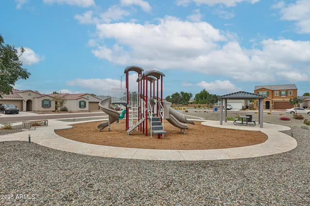 a view of a swimming pool with a yard