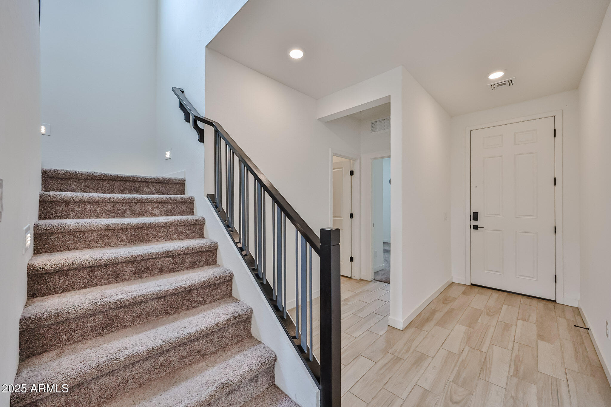 509 East Elm Lane Avondale, AZ 85323 - Photo 5 of 40 a view of a hallway with wooden floor and entryway