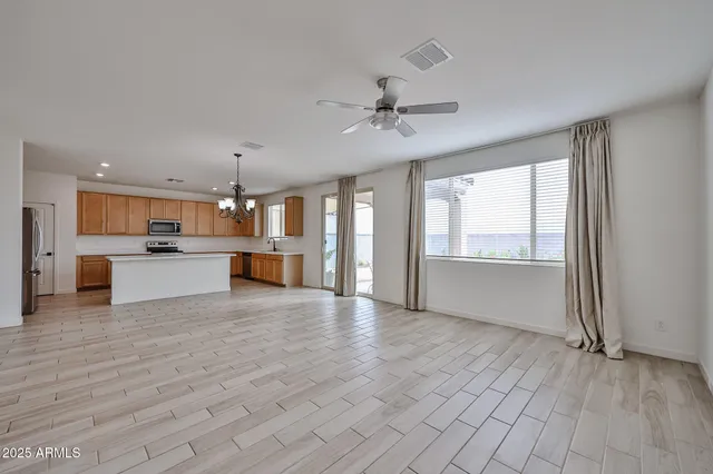 a view of a kitchen with a sink and a window