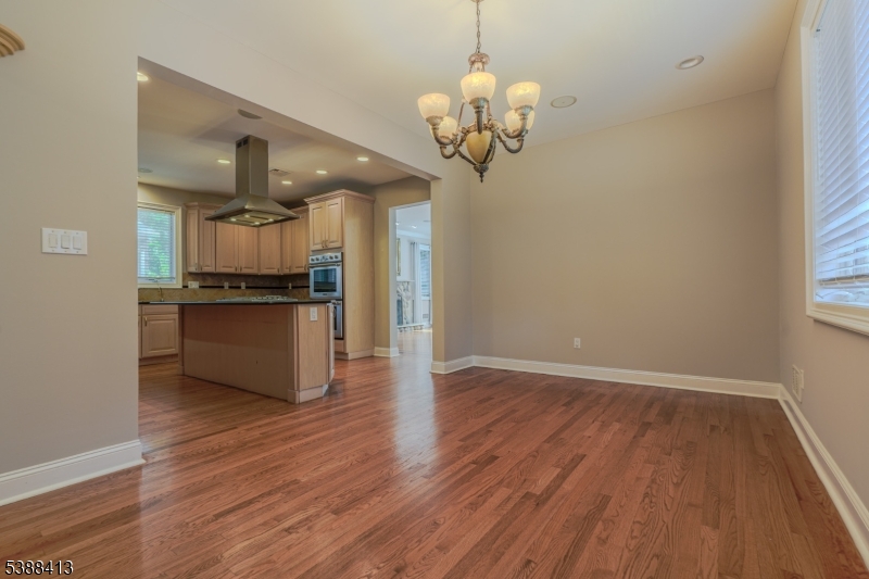 567 Mountain Avenue Springfield, NJ 07081 - Photo 9 of 28 a view of a kitchen with a sink and wooden floor
