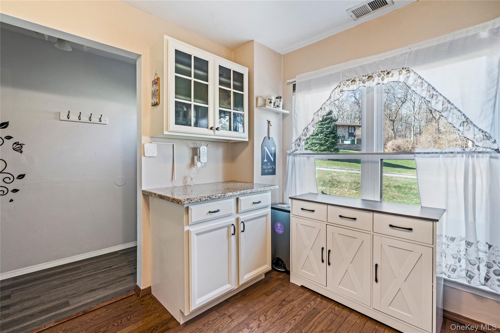 7 Maple Court, Unit 7 Selden, NY 11784 - Photo 4 of 18 a kitchen with granite countertop white cabinets and a window