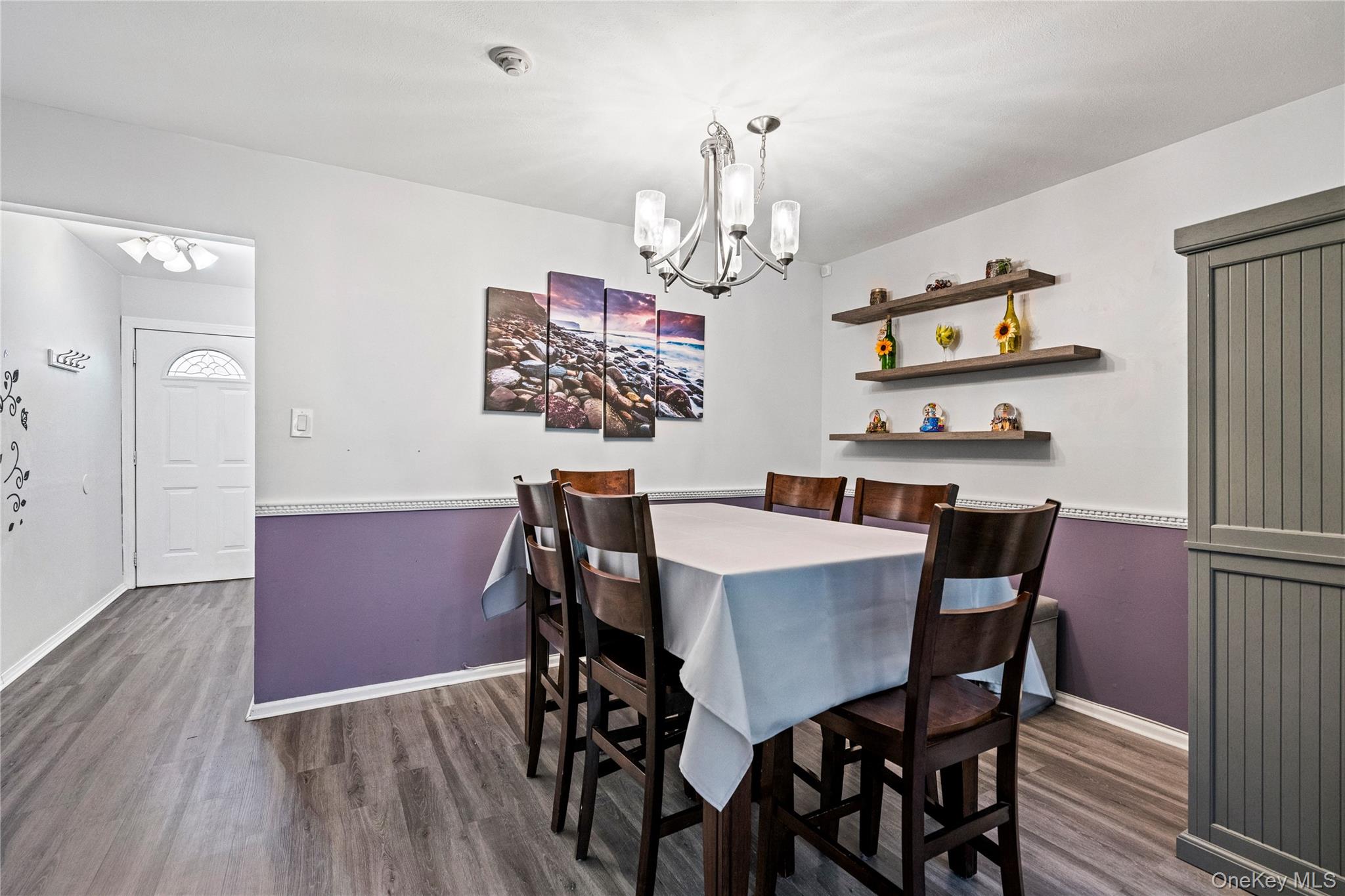 7 Maple Court, Unit 7 Selden, NY 11784 - Photo 8 of 18 a view of a dining room with furniture and wooden floor