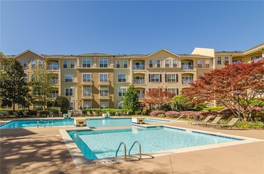 10 Perimeter Summit Boulevard, Unit 1310 Atlanta, GA 30319 - Photo 21 of 24 a view of a building with a swimming pool