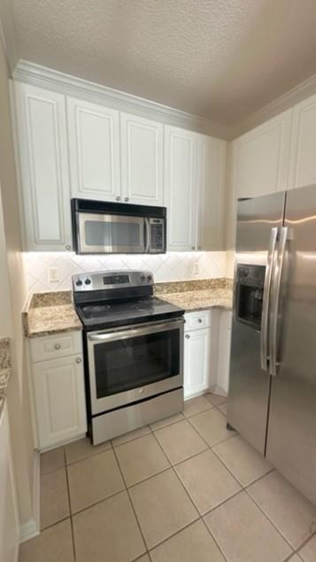 10 Perimeter Summit Boulevard, Unit 1310 Atlanta, GA 30319 - Photo 4 of 24 a kitchen with appliances cabinets and a sink