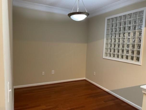 10 Perimeter Summit Boulevard, Unit 1310 Atlanta, GA 30319 - Photo 5 of 24 a view of an empty room with wooden floor and a window